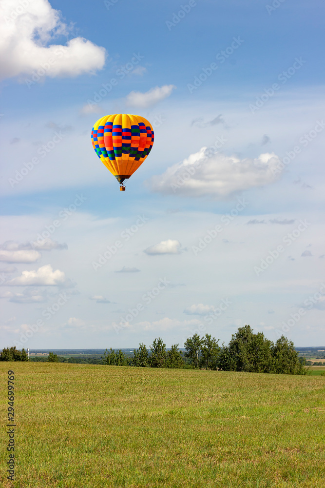 Balloons fly high above the fields.