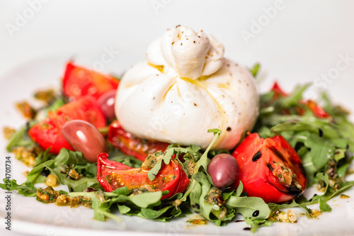 Salad with buratta cheese and tomatoes