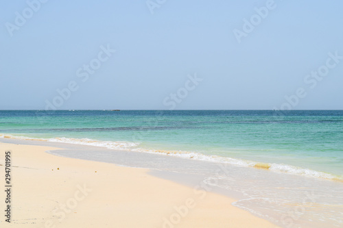 View from beach over the ocean, white sand and turquoise water, cayo levantado in the caribbean sea © Laila