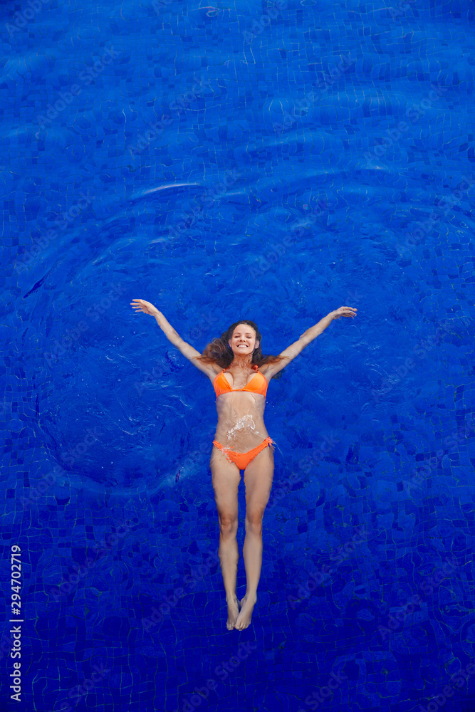 custom made wallpaper toronto digitalOverhead view of woman swimming underwater in a blue pool