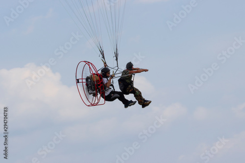 Romantic moto paragliding flights over the fields.
