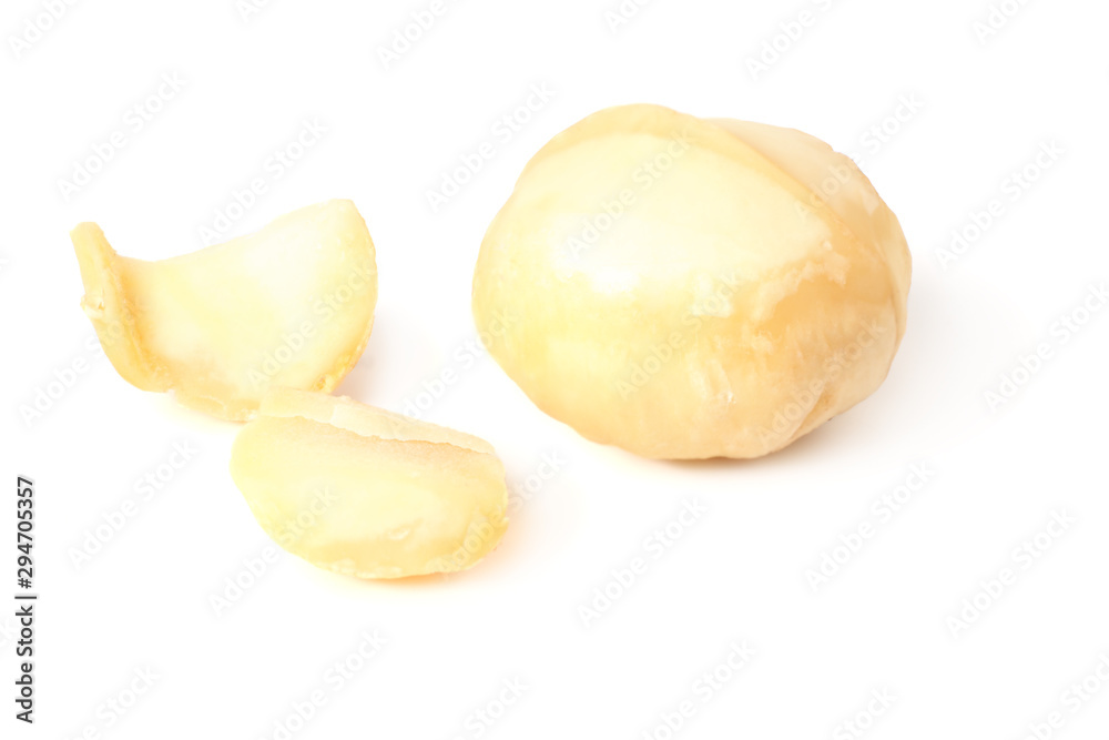 Macadamia nut with pieces isolated on a white background Macadamia nut with pieces isolated on a white background