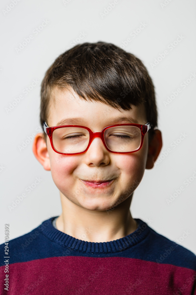 Funny Male Child with Glasses Making Faces Funny Male Child with Glasses Making Faces