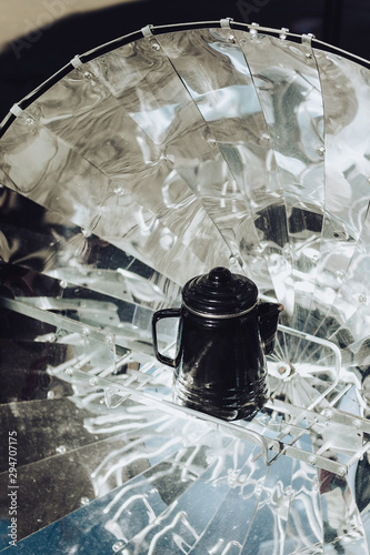 teapot on a solar cooker photo