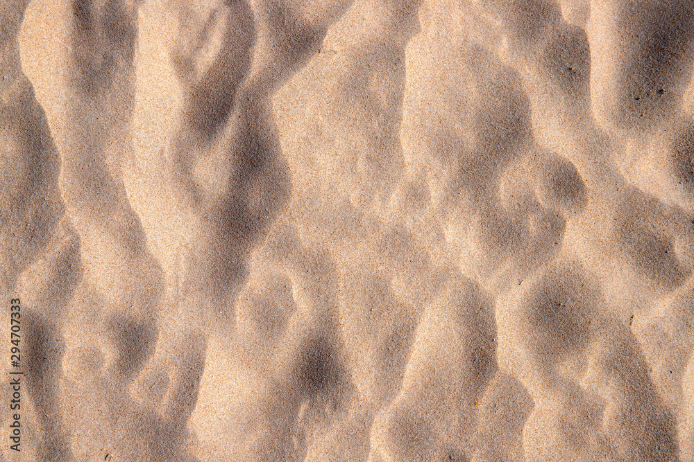 Beach sand texture with step marks. Sandy seashore top view photo. Tropical beach minimal banner template. Beach sand texture with step marks. Sandy seashore top view photo. Tropical beach minimal banner template.
