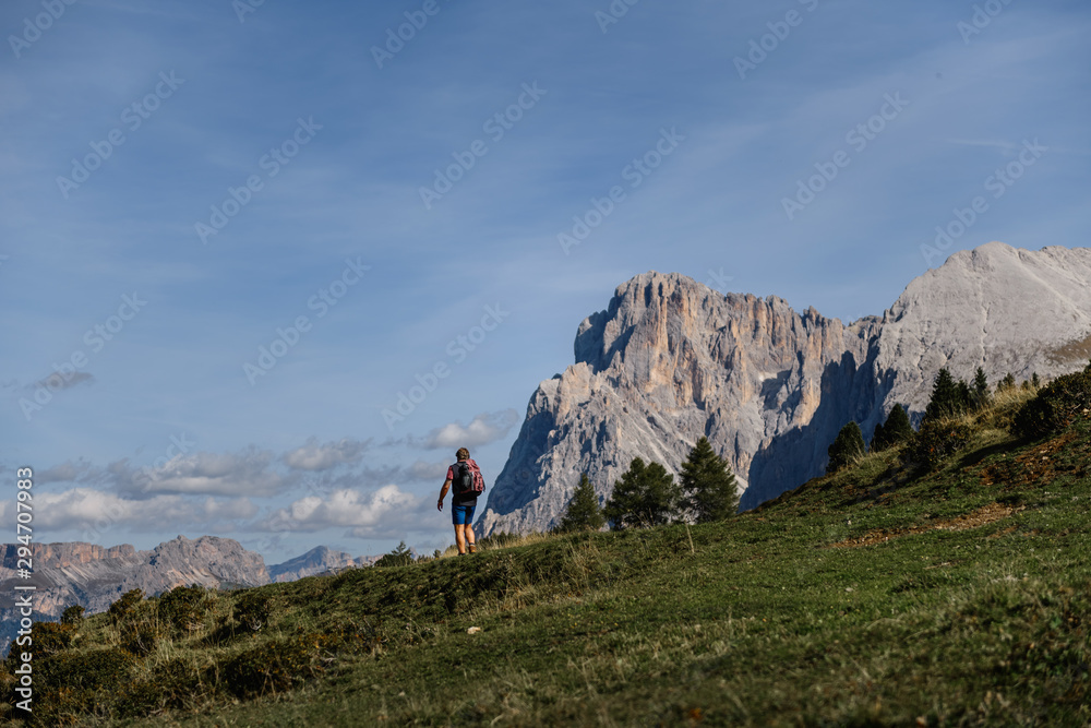 hikers walking on mountainous trail. Summer Trekking in Dolomites