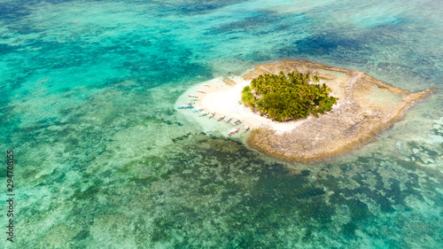 Guyam island, Siargao, Philippines. Small island with palm trees and a white sandy beach. Philippine Islands.