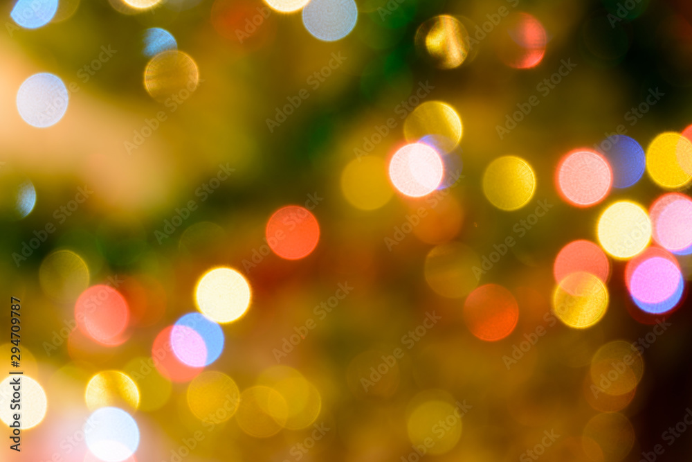 Fototapeta premium Defocused Christmas lights bokeh background. Christmas bokeh - Christmas tree in lights. Christmas concept.