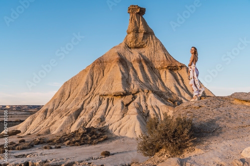 Lifestyle session of a model with a white dress and flowers at the Castildepiedra de las Bardenas  Navarra. Spain