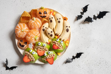 Healthy Halloween Treats. Banana Ghosts, Clementine Orange Pumpkins and Apple Monster Mounts