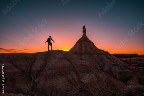 Bardenas reales  Navarra   Spain     October 4  2019  A young man on a beautiful sunset in the Bardenas
