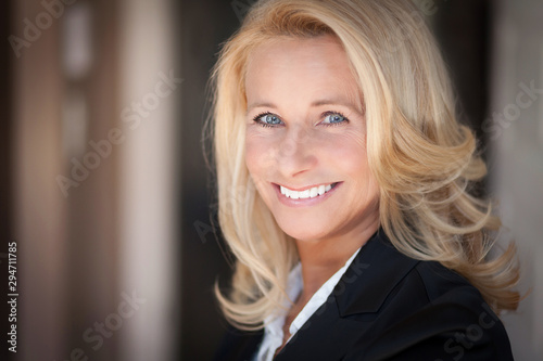 Mature woman smiling. Businesswoman