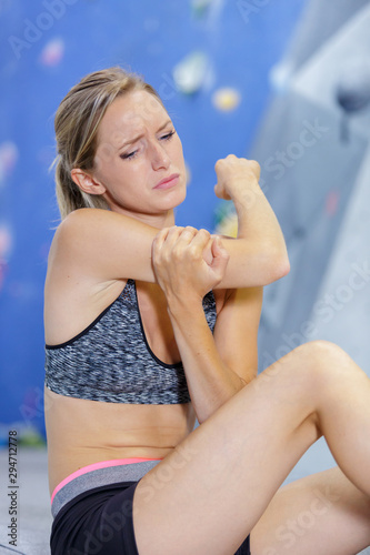 woman having arm pain due to exercise
