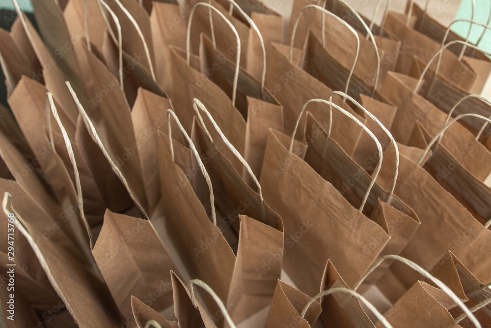 Obraz premium look from the top at the many open packages. environmentally friendly. place for text. Lots of craft packages close up. Business concept.