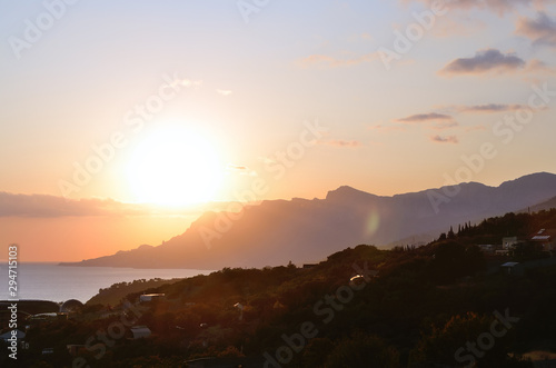Amazing beautiful summer sunset over the bay.Colorful sky above the sea and mountains. Sunset over the sea