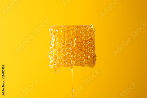 Obraz na płótnie Honeycomb against yellow background, copy space