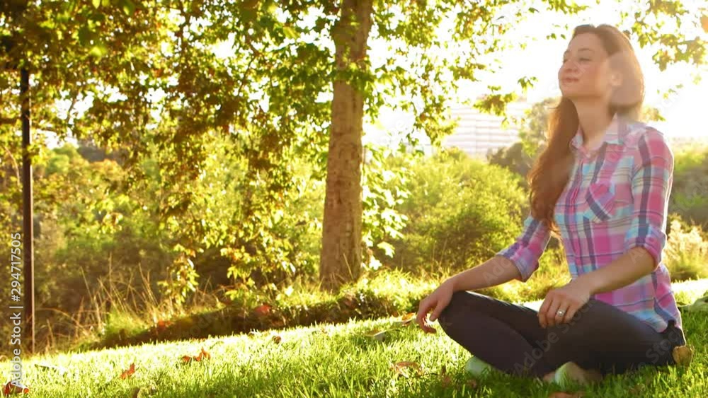 Woman Sitting Cross-Legged Calm and Serene Woman Sitting Cross-Legged Calm and Serene