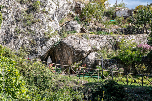 Statue of a Madonna in a small cave at the entrance to the medieval town of Roccalbegna, in the Grosseto Maremma. photo