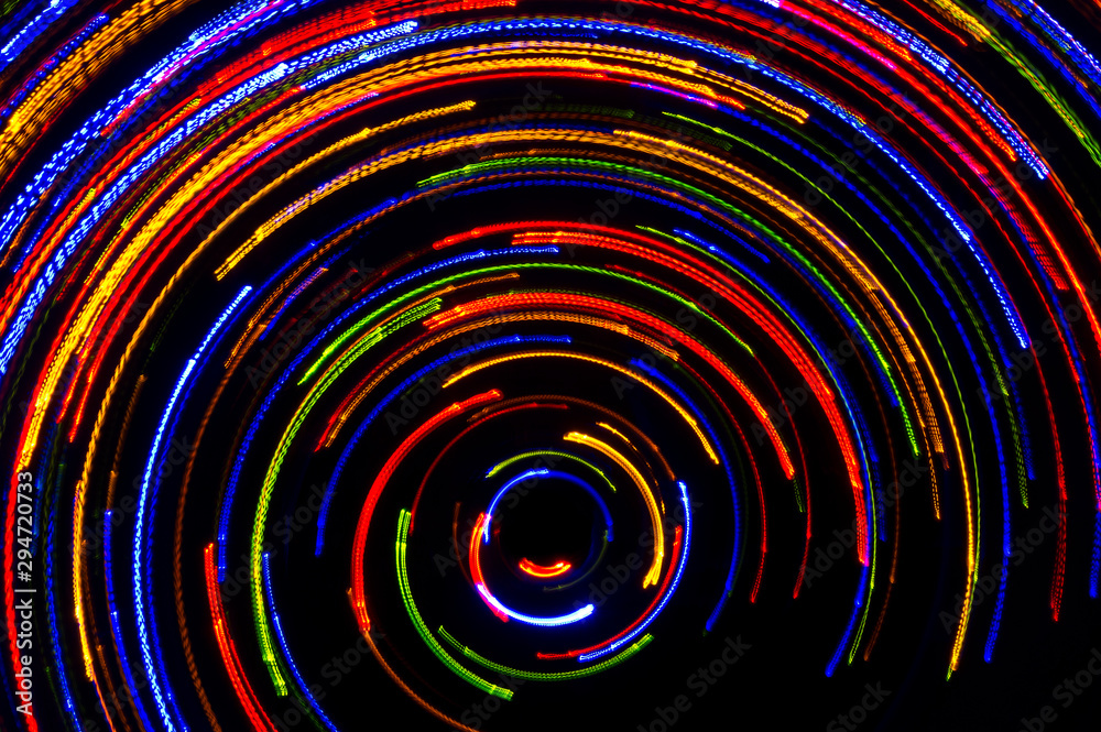 Rotating neon lights, spinning bright colorful laser lights background ...