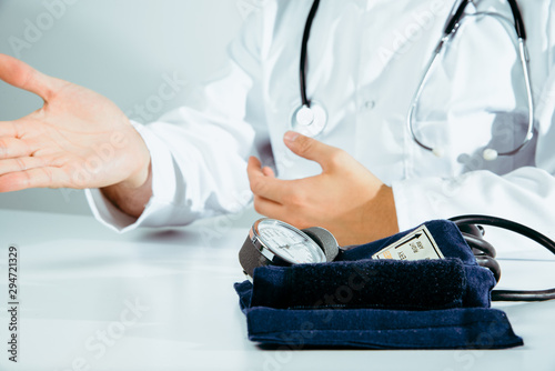 A doctor wearing a white coat talks to a patient. Medical and pharmaceutical concept. The doctor provides information about the patient s health  treatment of diseases  health problems.
