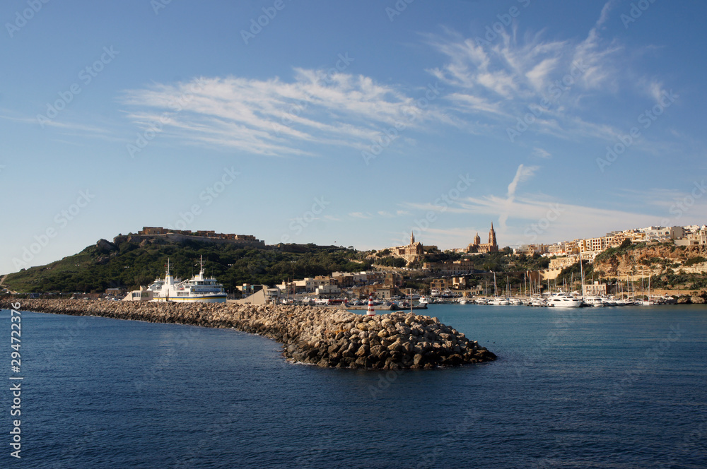 Landscape of Mgarr Harbor in Gozo, Malta visible from yacht deck