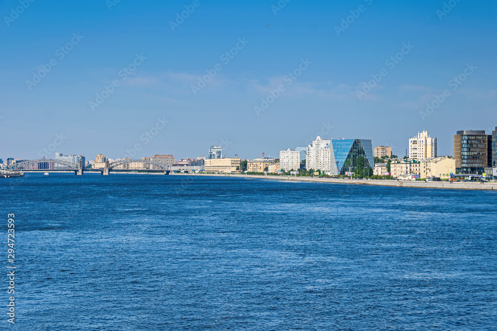 Malookhtinskaya Embankment with Bolsheokhtinsky Bridge and modern buildings of Leorsa Group in Saint Petersburg, Russia