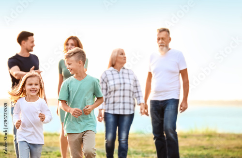 Little children with their family in park