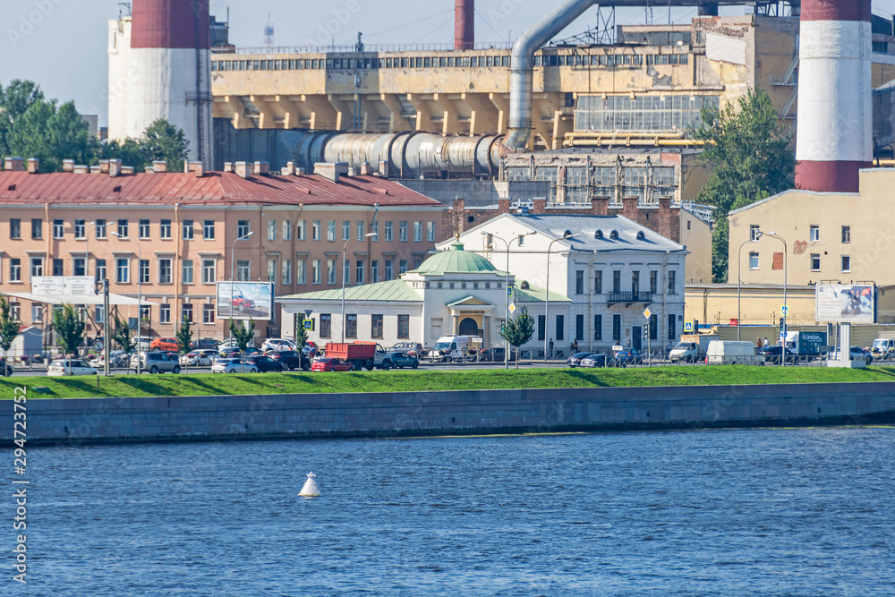 Sinopskaya Embankment with the Eukterion of the Orthodox Valaam Monastery and thermal power station in Saint Petersburg, Russia