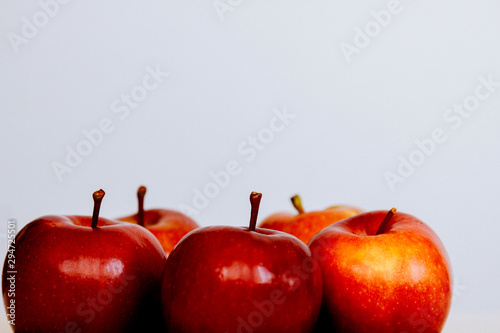 Five red juicy appes on a white background in isolation. Conceptually on the topic of healthy eating, veggie and diet photo