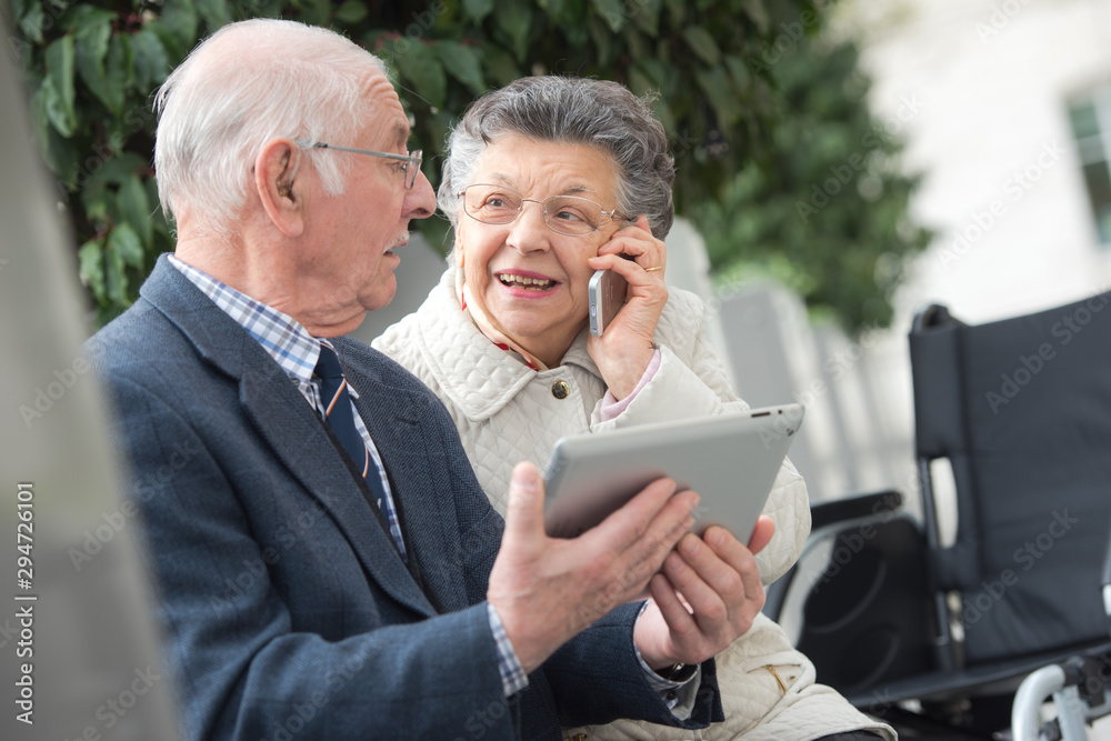 senior man using tablet with wife senior man using tablet with wife