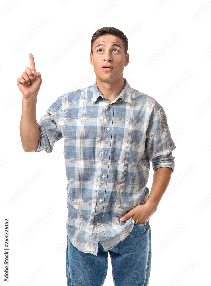 Portrait of handsome young man with raised index finger on white background Portrait of handsome young man with raised index finger on white background