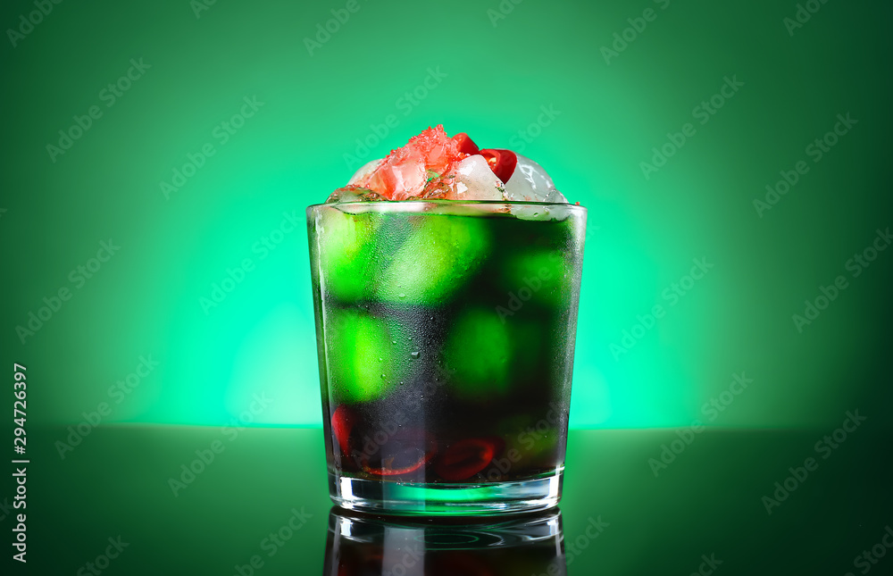 Glass of tasty cocktail on dark color background Glass of tasty cocktail on dark color background