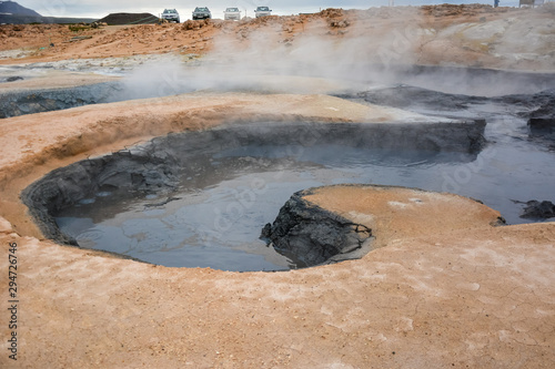 Boiling mudpots in the geothermal area Hverir and cracked ground around, Iceland in summer. Myvatn region, North part of Iceland photo