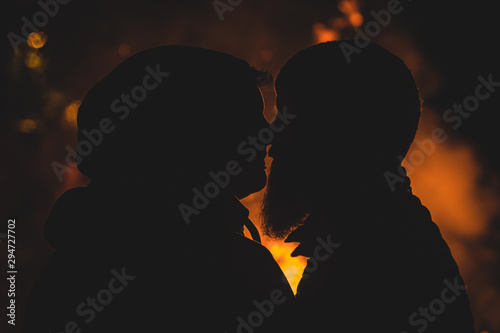 Silhouette of romantic hipster couple © Anze