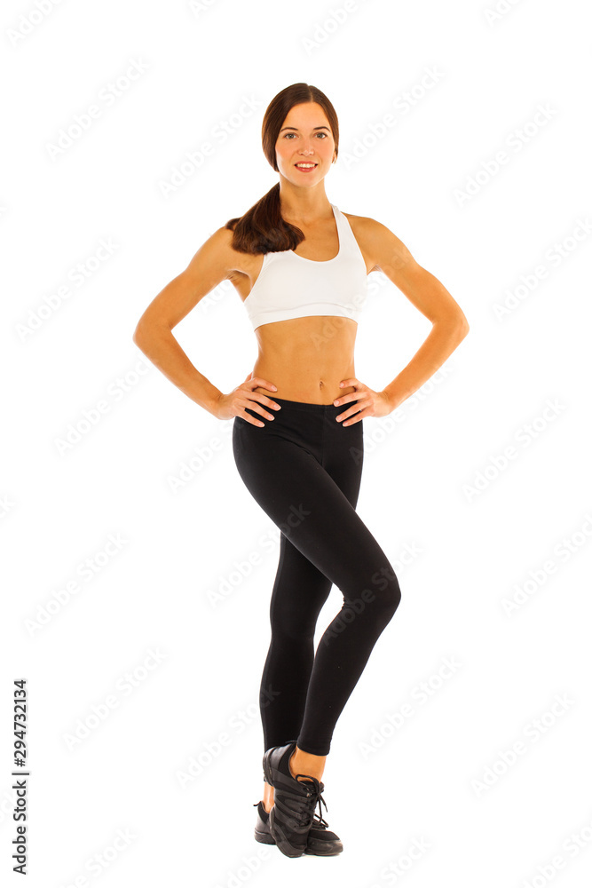 Sexy fitness woman posing in studio - isolated on a white background Sexy fitness woman posing in studio - isolated on a white background