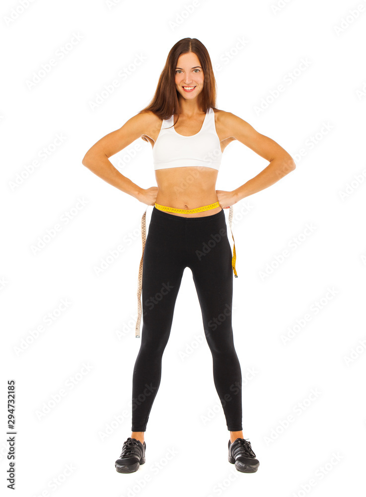 Sexy fitness woman posing in studio - isolated on a white background Sexy fitness woman posing in studio - isolated on a white background