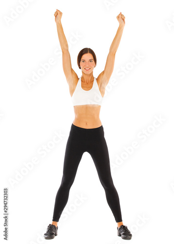 Sexy fitness woman posing in studio - isolated on a white background