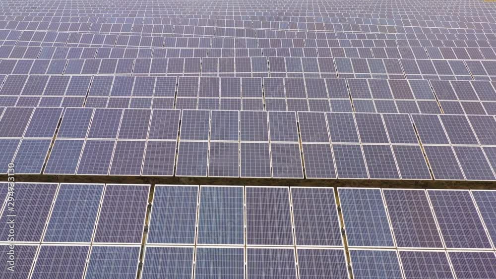 Renewable electricity, unmanned flight over a solar power plant located in the field. Renewable electricity, unmanned flight over a solar power plant located in the field.