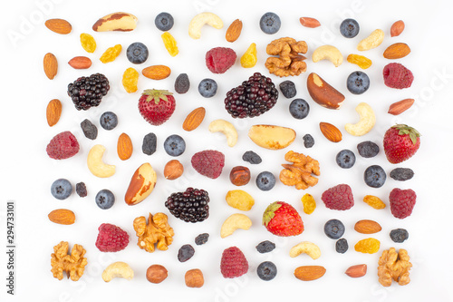 Fototapeta Naklejka Na Ścianę i Meble -  different berries and nuts on a white background. vitamin proteins and healthy foods
