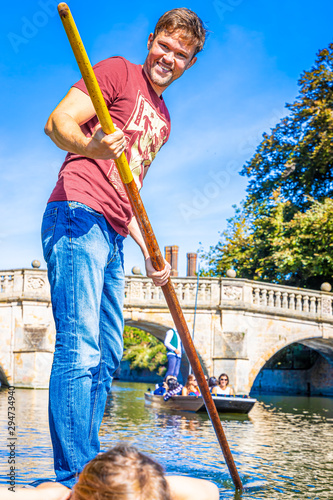 Father with children on family punting in Cambridge