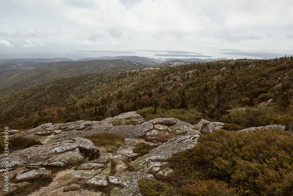 View of Maine coastline in the distance from Cadillac Mountain on Mount Desert Island in Acadia National Park