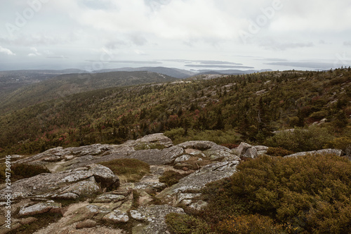 View of Maine coastline in the distance from Cadillac Mountain on Mount Desert Island in Acadia National Park © Jen Lobo