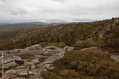 View of Maine coastline in the distance from Cadillac Mountain on Mount Desert Island in Acadia National Park © Jen Lobo