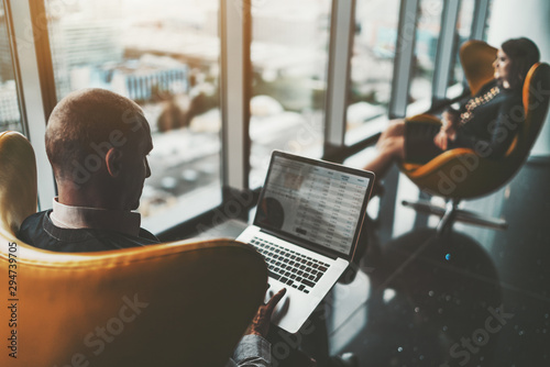 Принти на полотні Two business partners in a luxurious interior of a office skyscraper: a caucasia