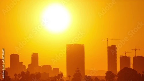 Time Lapse of the sun rising from behind downtown Los Angeles photo