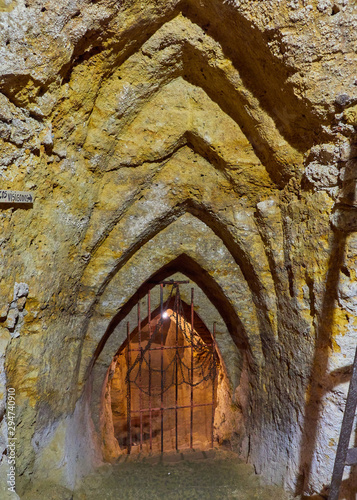 Vertical front view of unique visigoth arches in the arab caves labyrinth built under the medieval city of Brihuega, Guadalajara, Alcarria, Castilla la Mancha, Spain photo