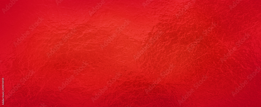 Fototapeta premium Red background foil texture, abstract Christmas holiday color paper with shiny crackled textured design