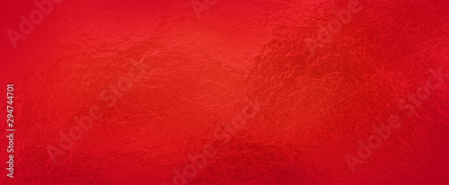 Red background foil texture, abstract Christmas holiday color paper with shiny crackled textured design