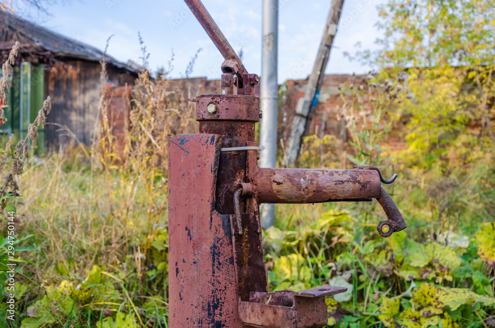 an old iron water tap on the street.