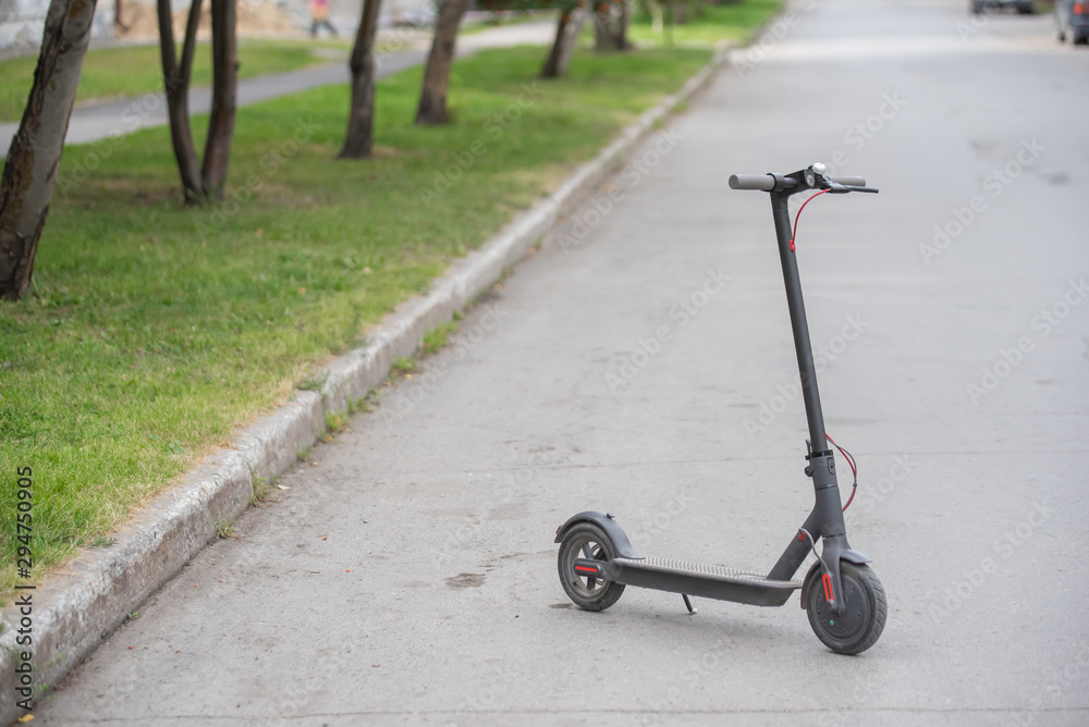 Electric Scooters on the Sidewalk. Convenient electric vehicles for quick movement around the city.